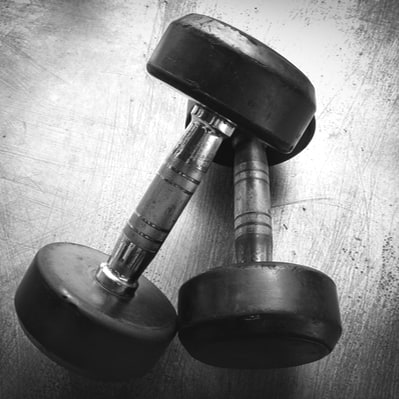 Black and white photo chrome and black barbells.