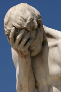 Photo of a classy statue doing a “facepalm” of disbelief. The statue is actually Henri Vidal’s depiction of “Cain After Killing His Brother Abel,” on display in the Tuileries Garden in Paris.