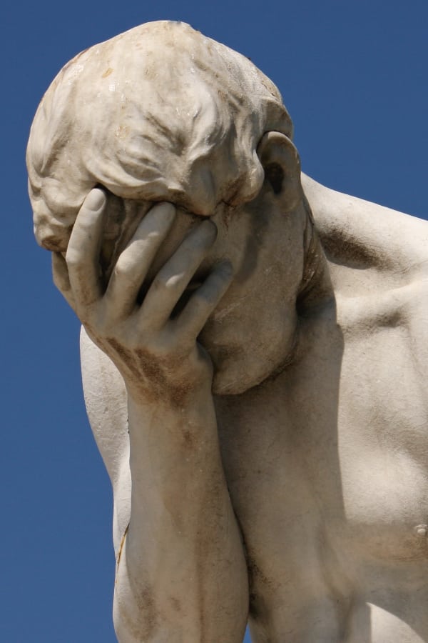 Photo of a classy statue doing a “facepalm” of disbelief.