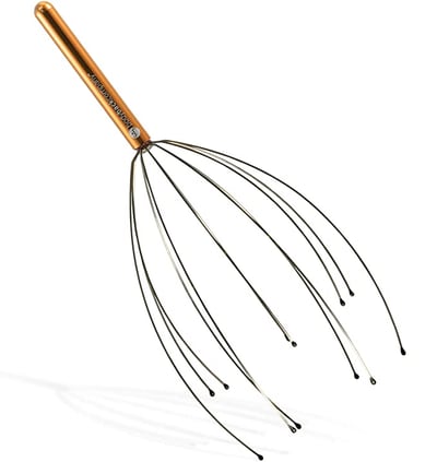 Photograph of a scalp vibrator head massage tool.