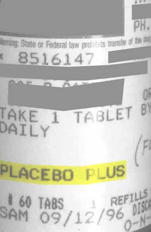 Low quality photo of the label on a prescription pill bottle for the medication “PLACEBO PLUS,” highlighted in yellow. Instructions read “Take 1 tablet daily.” The prescription date is marked as “09/12/96,” and there is a note about refills.
