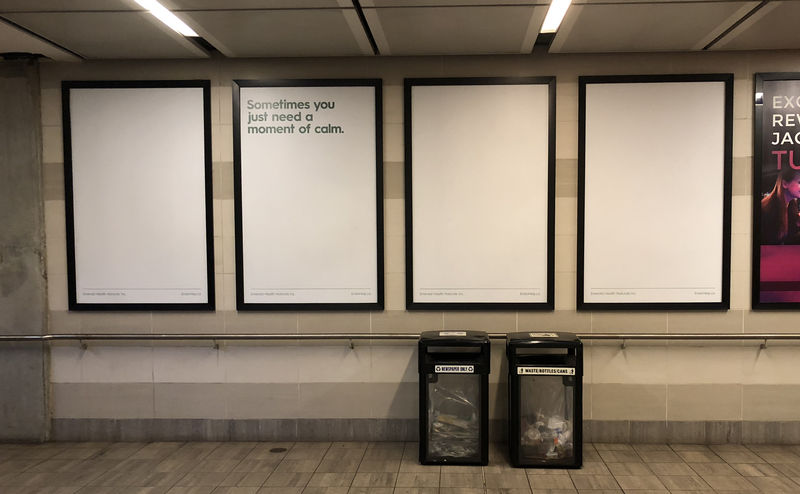 Photo of four large posters in a train station, advertising CBD. Three of the four are completely blank, and the second has the caption “Sometimes you just need a moment of calm.”