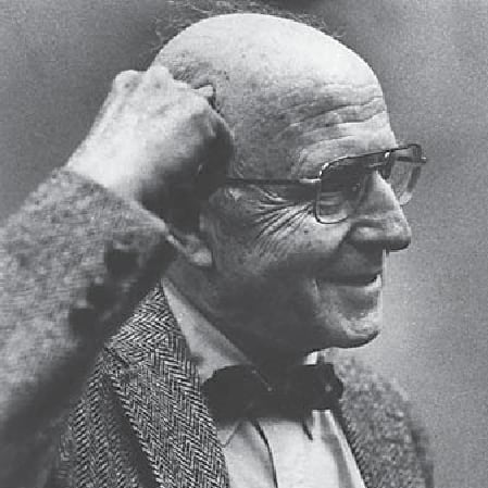B&W photo of George L. Engel, pointing at his head.