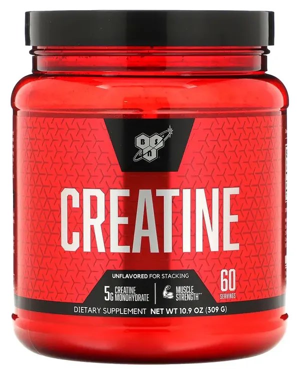 Photograph of a huge bright red bucket of creatine monohydrate.