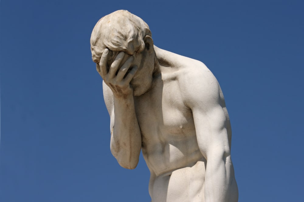 Photo of a classy statue doing a “facepalm” of disbelief. The statue is actually Henri Vidal’s depiction of “Cain After Killing His Brother Abel,” on display in the Tuileries Garden in Paris.