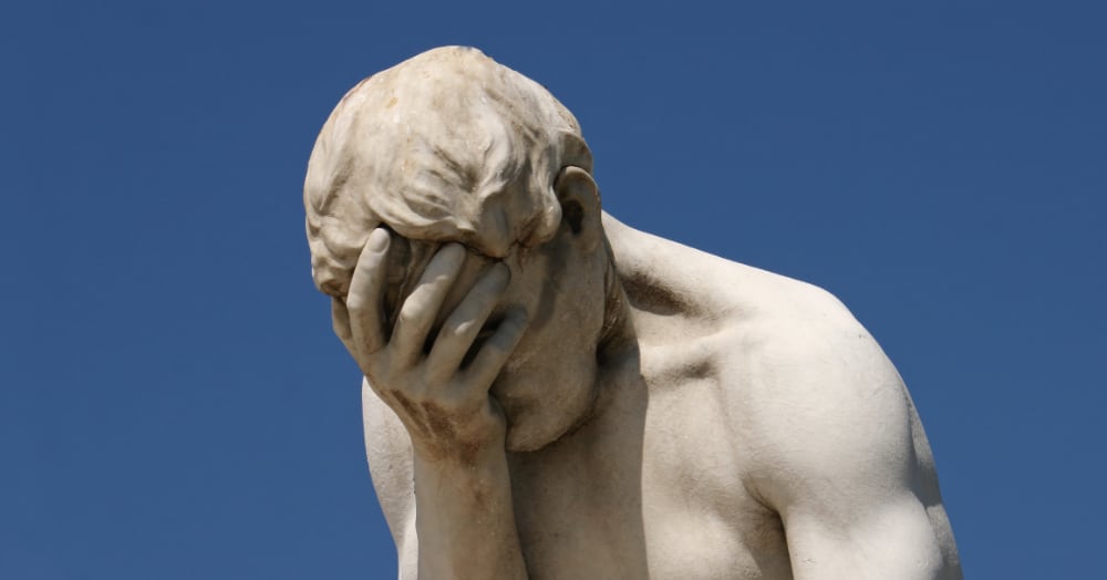Photo of a classy statue doing a “facepalm” of disbelief.