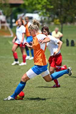 Photo of girls playing soccer.