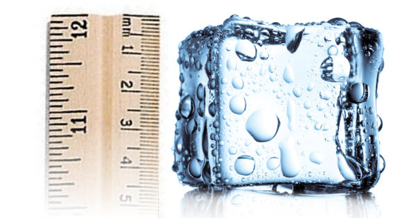An ruler beside an ice cube, representing the depth of tissue temperature change in cryotherapy.