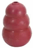 Photogrpah of a KONG dog toy, which is hard cone of red rubber with a hole through the centre of it. It’s a surprisingly good massage tool.
