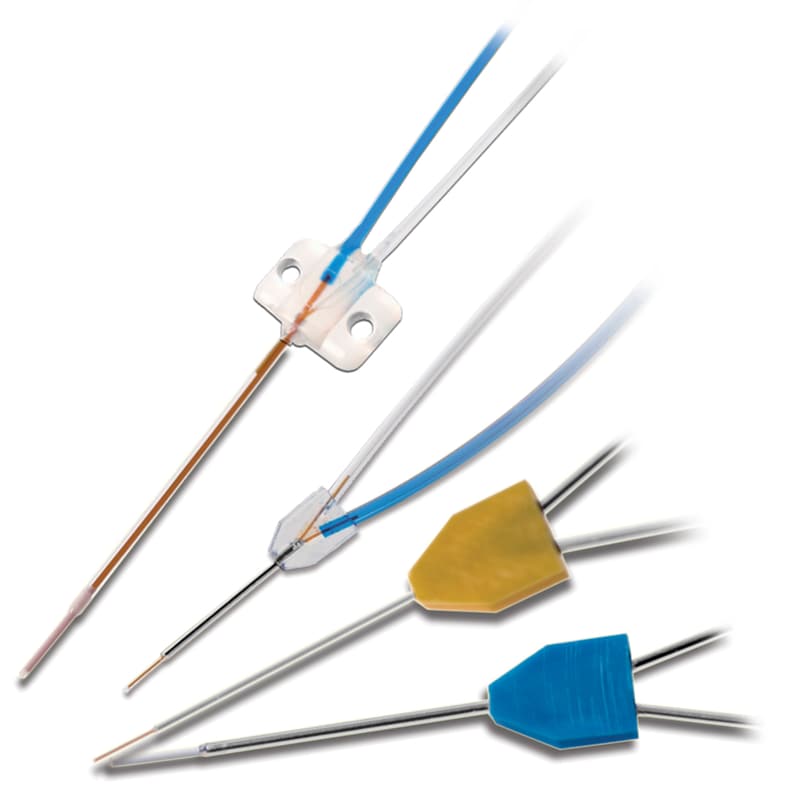 Photograph of four different types and sizes of microdialysis probes, isolated on white.
