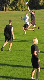 Photograph of me playing ultimate frisbee, an intense sport that regularly makes me extremely sore, even though I’m quite well adapted to it.