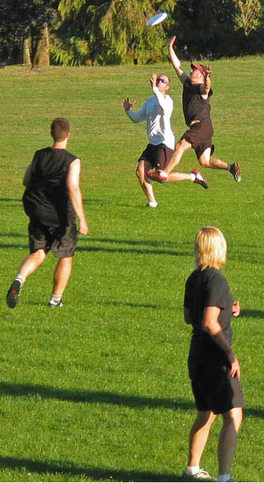 Photograph of me playing ultimate, a sport that has caused many cramps and a few muscle strains over the years.