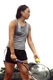 Woman playing tennis, getting ready to serve.