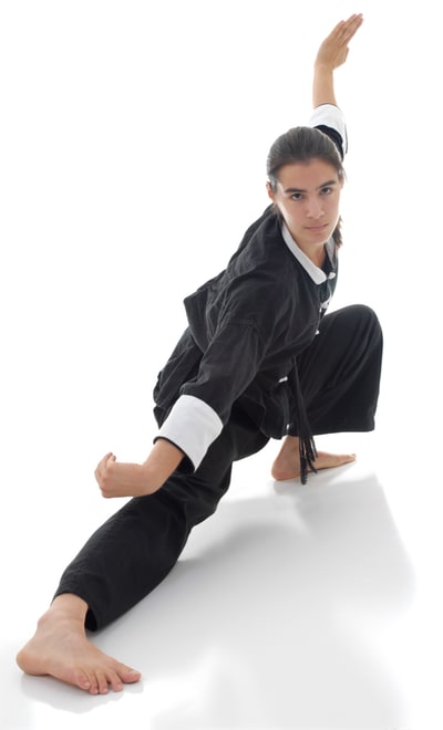 Photo of a woman in a fancy taiiiquan position.